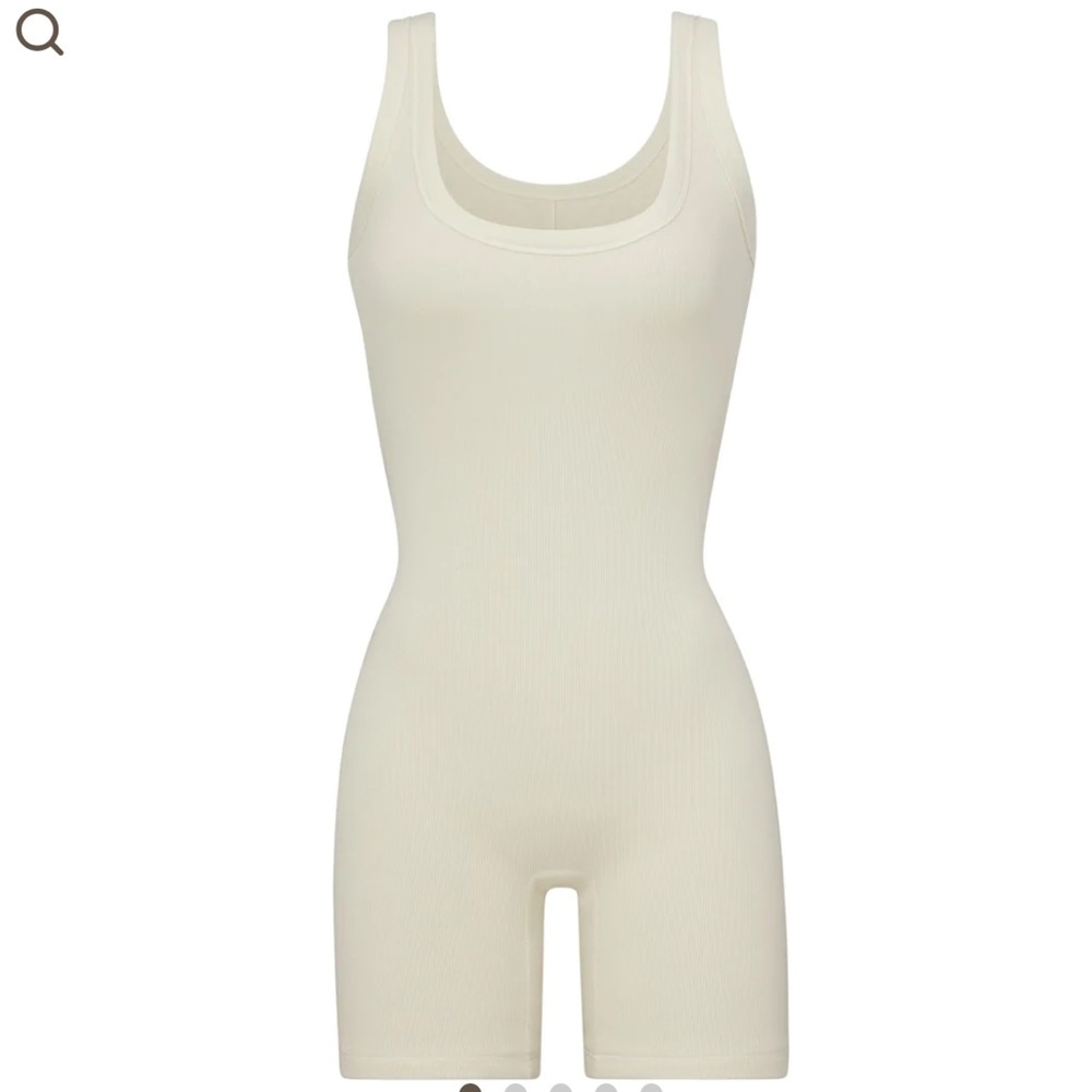 SKIMS signature mid-thigh bodysuit silhouette in bone